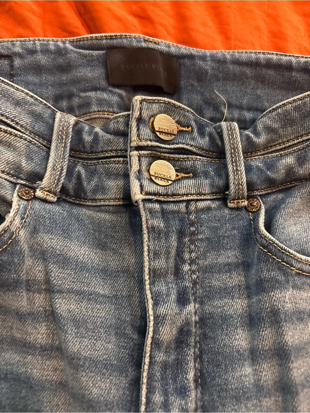 Buckle Skinny Jeans in Medium Blue Wash